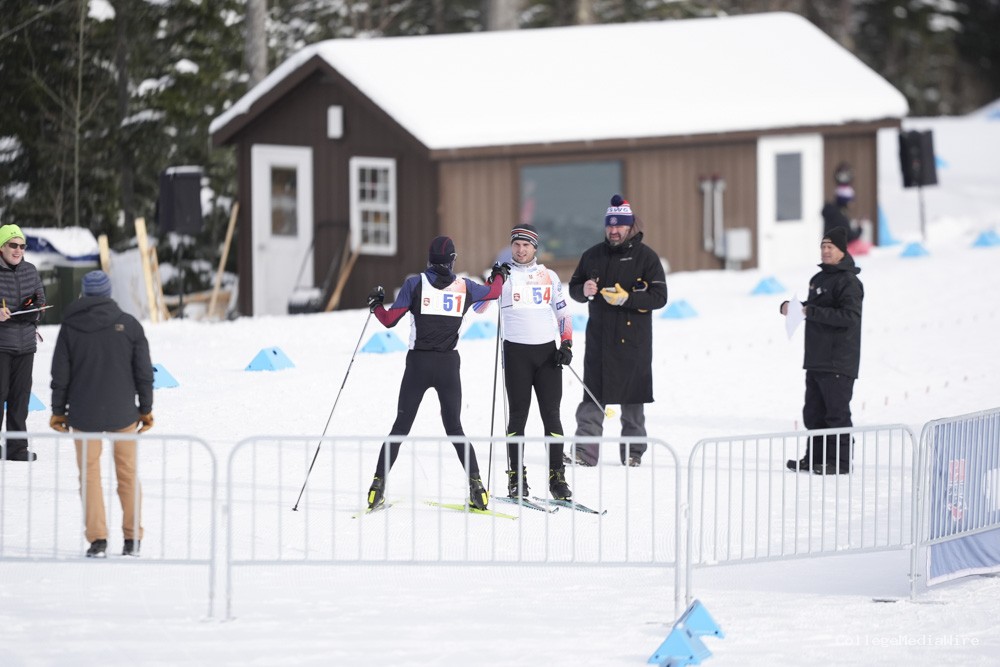 A group of athletes skiing in the snow
