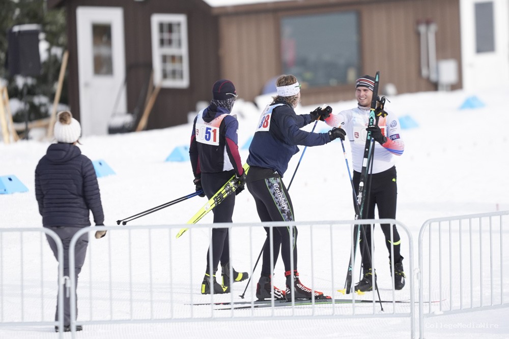 A group of athletes skiing in the snow