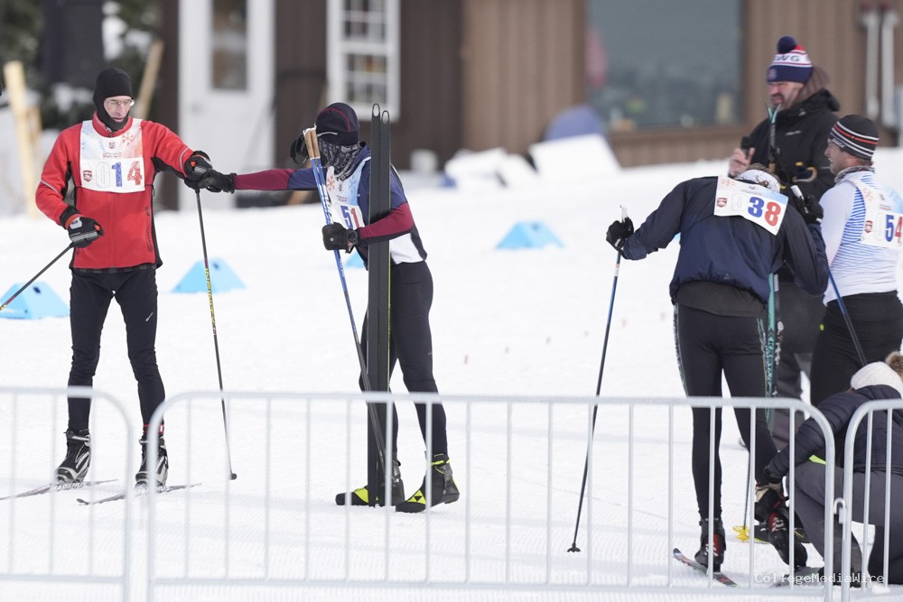 A group of athletes skiing in the snow